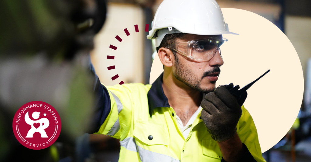 A man wearing a hard hat and safety glasses.